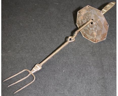 A charcoal iron toasting fork with shield, designed by Ernest Gimson, made by Alfred Bucknell, Water Lane circa 1925, the shi