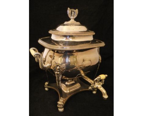 A 19th Century twin-handled plated samovar of rectangular bellied form, the lid with acorn and leaf finial, raised on four le