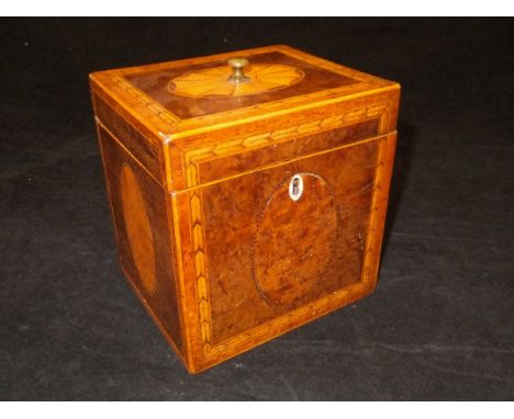 A George III burr walnut marquetry and parquetry inlaid tea caddy of rectangular form, the hinged lidded top with turned bras