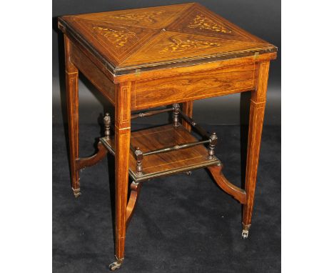 An Edwardian rosewood and inlaid envelope card table, the top opening to reveal a baize-lined interior and counter dishes, ab