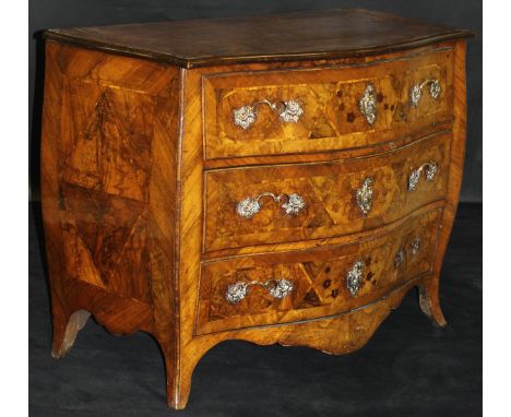 An 18th Century Dutch walnut commode of serpentine fronted bombé form, the figured top with moulded edge above three drawers 