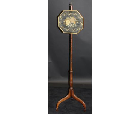 A 19th Century mahogany pole screen with long stitch needlework floral display panel and turned brass finial to top, raised o