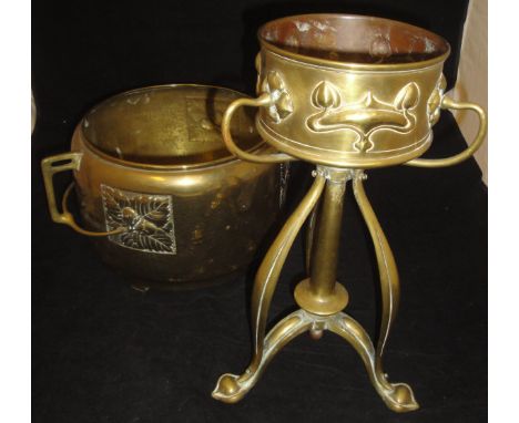 A Württembergische Metalwarenfabrik (WMF) brass twin-handled jardinier embossed in square panels with acorns and oak leaves, 