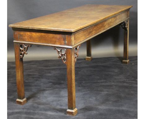 A George III mahogany serving table in the Chippendale taste, the plain top above a plain apron with moulded edge and pierced