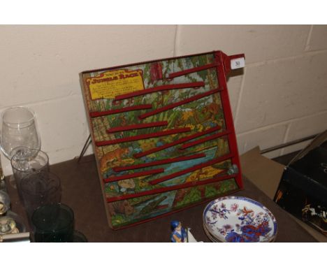 A vintage American tin plate "Jungle Race" game