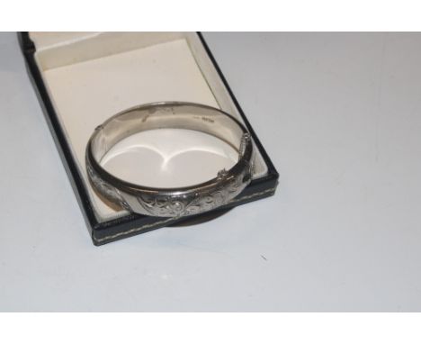 A 1960 Harrods Birmingham Sterling silver hinged bangle 