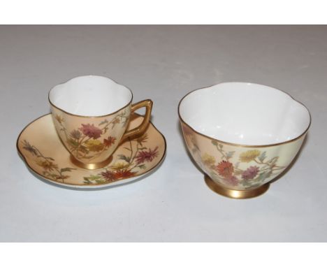 A Royal Worcester floral decorated cup and saucer and matching sugar bowl