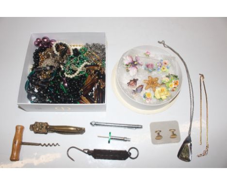 Two boxes containing floral encrusted and other brooches; various costume jewellery; bead necklaces; corkscrew; nut crackers 