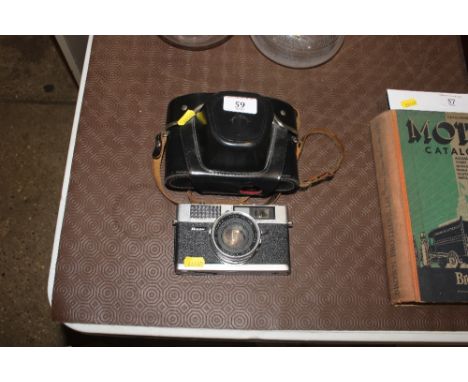 A Praktica camera and a Ricoh camera 