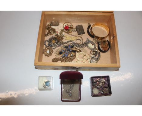 A wooden box and contents of costume jewellery including dress rings, a 9ct gold plated bangle, wrist watches etc.