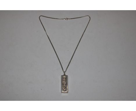 A 1977 Carrs of Sheffield Sterling silver 1 troy ounce ingot and chain