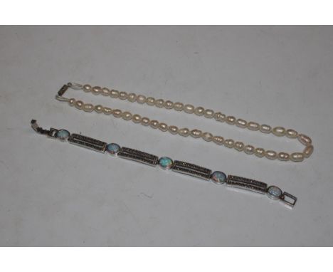 A 925 silver opal and marcasite set bracelet and a pearl necklace 