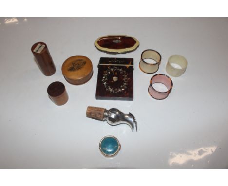 A box containing mother of pearl and tortoiseshell card case; a faux tortoiseshell compact; napkin rings; a Mauchline ware bo