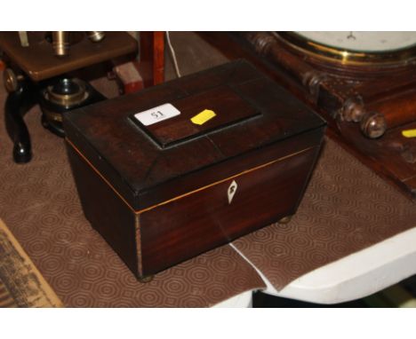 A 19th Century mahogany sarcophagus shaped two compartment tea caddy 
