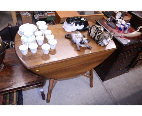 An Ercol drop leaf dining table 