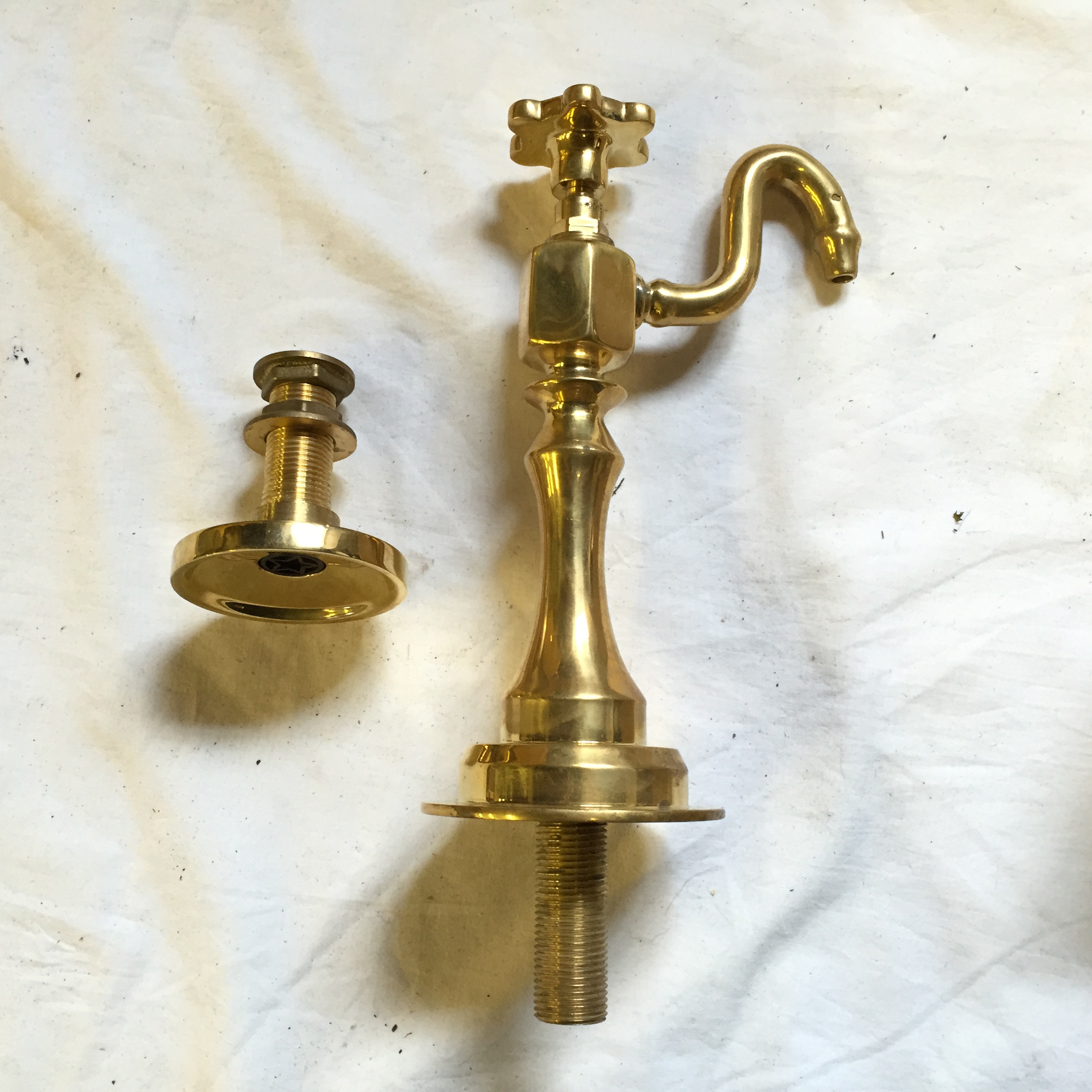 A brass bar water tap.