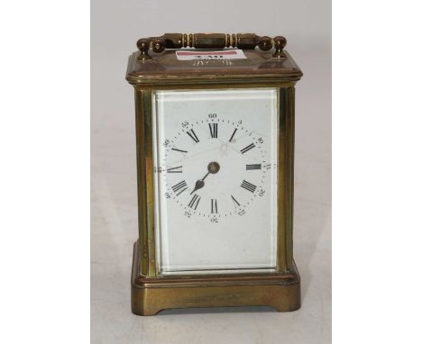 An early 20th century lacquered brass carriage clock, the enamel dial showing Roman numerals (a/f) height 12cm