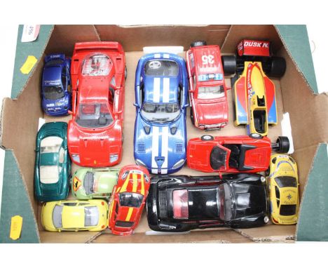 A box containing a collection of diecast model vehicles to include Bburago
