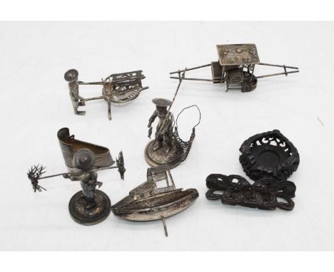 An early 20th century  Chinese silver model of a sedan chair, together with a model of a junk, two fisherman, and a street ve