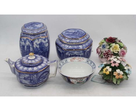 A box of miscellaneous items to include Imari bowl, Ringtons Millennium storage jar and cover, teapot, flower posies, etc