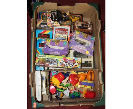 A collection of various vintage toys to include diecast model vehicles and McDonalds Happy Meal toys