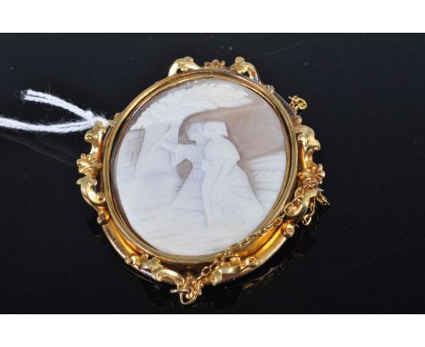 A carved shell cameo brooch in pinchbeck mount, with safety chain, 55 x 50mm