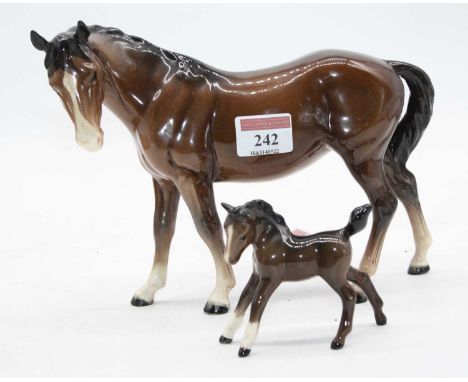 A Beswick model of a mare, model No. 976, brown gloss, height 17cm; together with a similar foal