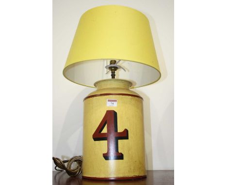 A modern Toleware type table lamp from Woolpit Interiors, in the form of a yellow canister painted in red with a number 4, ha