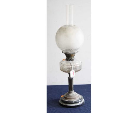 A late Victorian oil lamp, having opalescent globular shade above a clear glass font, on a fluted column and socle base