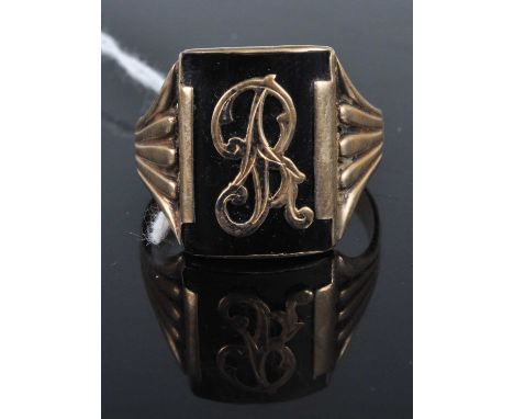 A gent's vintage yellow metal and black enamel signet ring, stamped 9ct, 6.8g, size X