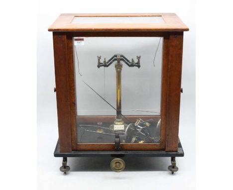 A mid-20th century teak cased set of laboratory scales, w.44cm