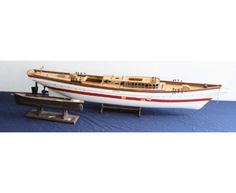 A part kit-built model of a cruiser, length 113cm; together with one other partially built boat hull (2)