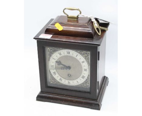 A mid-20th century walnut cased bracket clock, in the 18th century style, having a silvered chapter ring with Roman numerals,