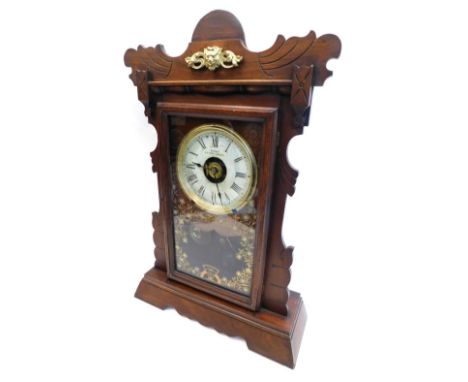 A late 19thC American mantel clock, in a walnut case, with gilt metal mount, the dial stamped Woods Patent Alarm, on bracket 
