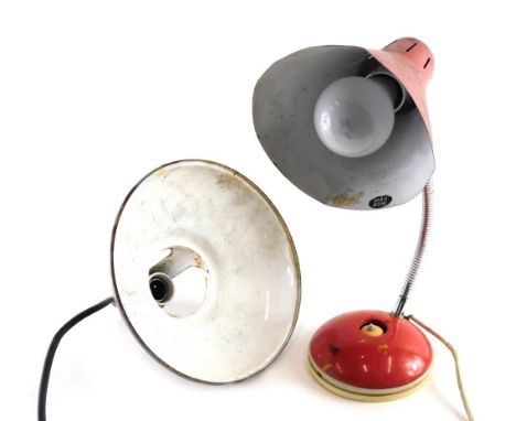 A vintage anglepoise lamp, with red cone shaped shade on articulated stem and domed foot, 43cm high.