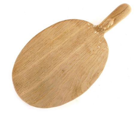 A Robert Mouseman Thompson of Kilburn light oak cheese board, with carved mouse handle, 39cm long.