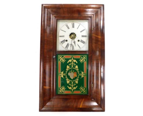 A late 19thC American wall clock by The Waterbury Clock Company, in ogee shaped mahogany case, with stencilled and painted di