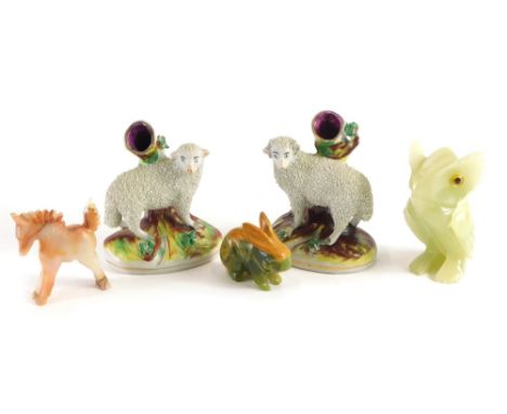 A pair of Staffordshire style sheep spill holders, on rock work bases, 11cm high, jade finished animals, polished jade horse,
