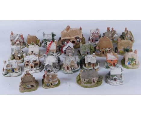 A group of Christmas Lilliput Lane Cottages, comprising Chestnut Cottage, Robin Cottage, The Gingerbread Shop, Holly Tree Hou