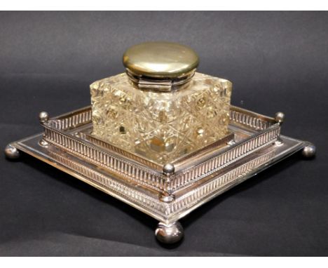 An Edward VII silver plated and cut glass ink stand, by Mappin &amp; Webb, the diamond shaped inkwell, with plain circular hi