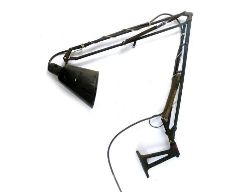 A vintage anglepoise wall mounting light, with cone shaped shade and articulated stem with cylindrical fitting, 107cm high.