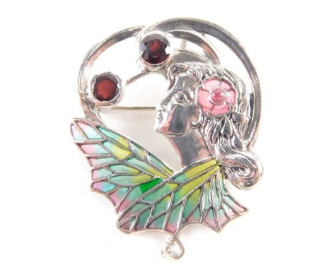 A silver plique-a-jour flora ladies pendant/brooch, depicting female figure with enamel type detail, set with cabochon rubies