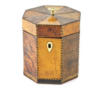 A late 19thC maple and amboyna tea caddy, of octagonal form, with chequer strung borders enclosing a loose cover with foil in