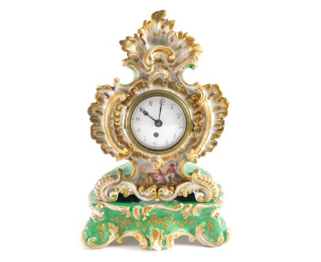 A 19thC French porcelain mantel clock by Jacob Petit, in a shaped gilt highlighted shell, scroll and floral case, hand painte