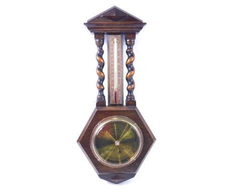 An oak cased barometer, with barley twist supports and hexagonal lower case, the brass dial engraved Rowley Nottingham, 51cm 