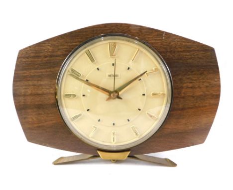 A retro teak cased Metamec mantel clock, with 13cm diameter Arabic dial, shaped cased with battery movement. 