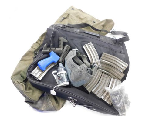 Various US army air force uniform carriers air soft parts and face masks.