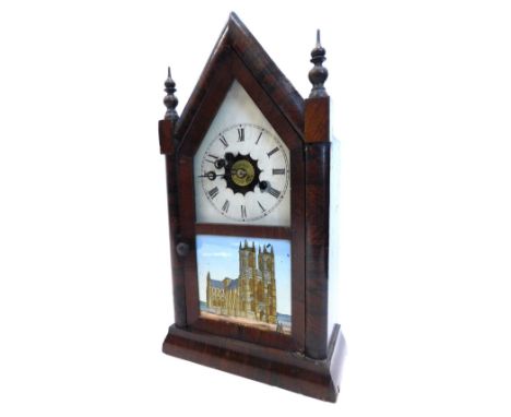 A late 19thC American mantel clock by Jerome and Co, the arched rosewood case with turned finials, the door inset with a prin