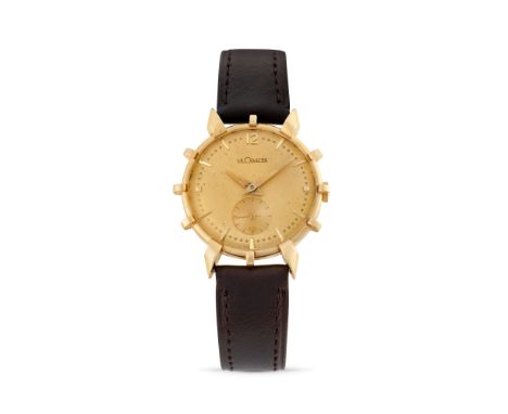 Jaeger-LeCoultre Helm, 50s14k gold round case with spikes, n.33724, fancy lugs.Mustard coloured dial, applied indexes.Hand-wi