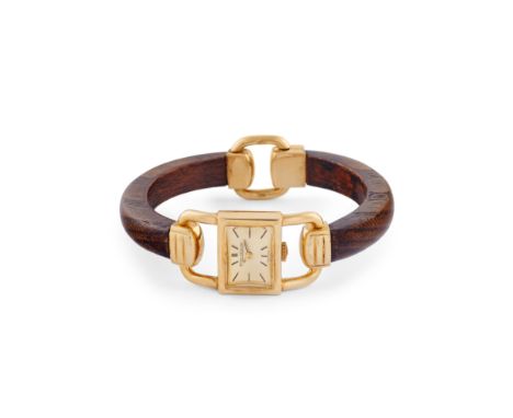 Jaeger-LeCoultre Etrier wood bracelet watch, 50s18k gold stirrup shaped case, n.1341414.Champagne dial, applied indexes.Hand-